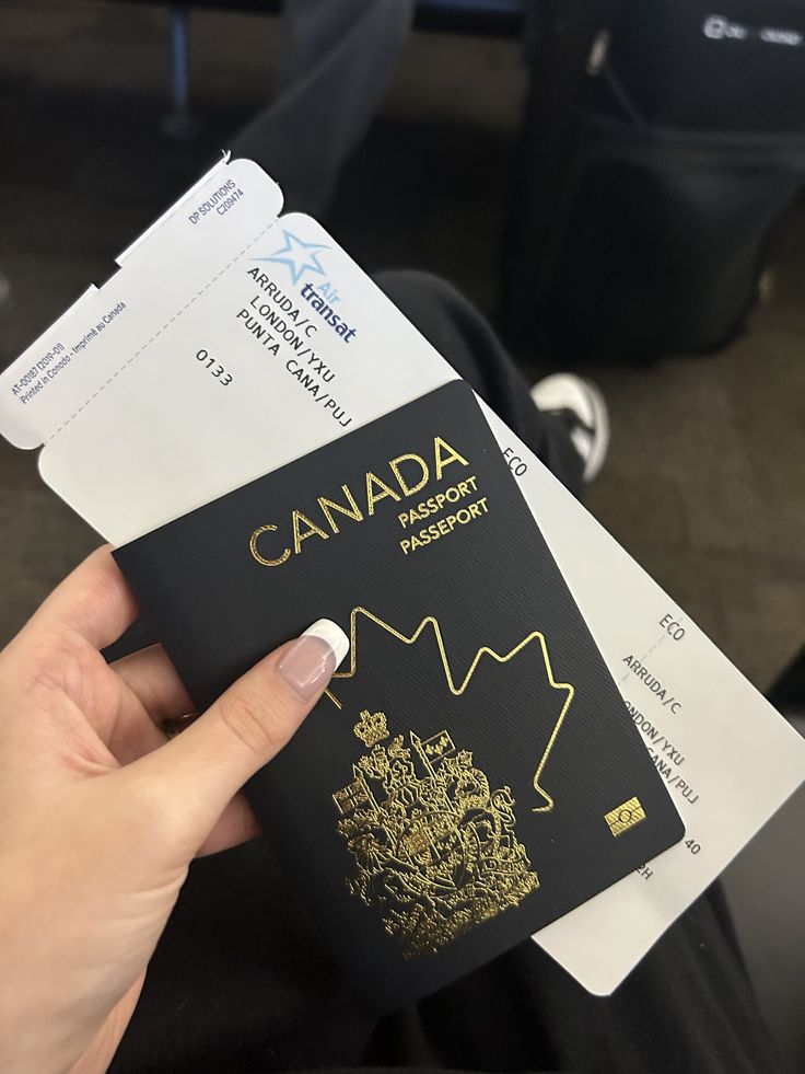 Canadian passport and travel papers pictured during a journey